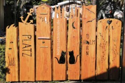 Zaun als Gestaltungselement Holzgartenzaun mit unterschiedlichen Motiven
